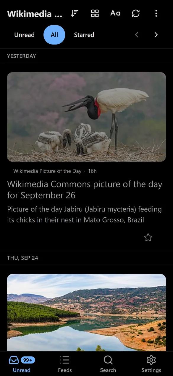 Kipple on a phone in Midnight, showing the article list with large photos.